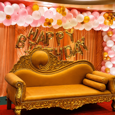 Gold sofa at festive birthday celebration